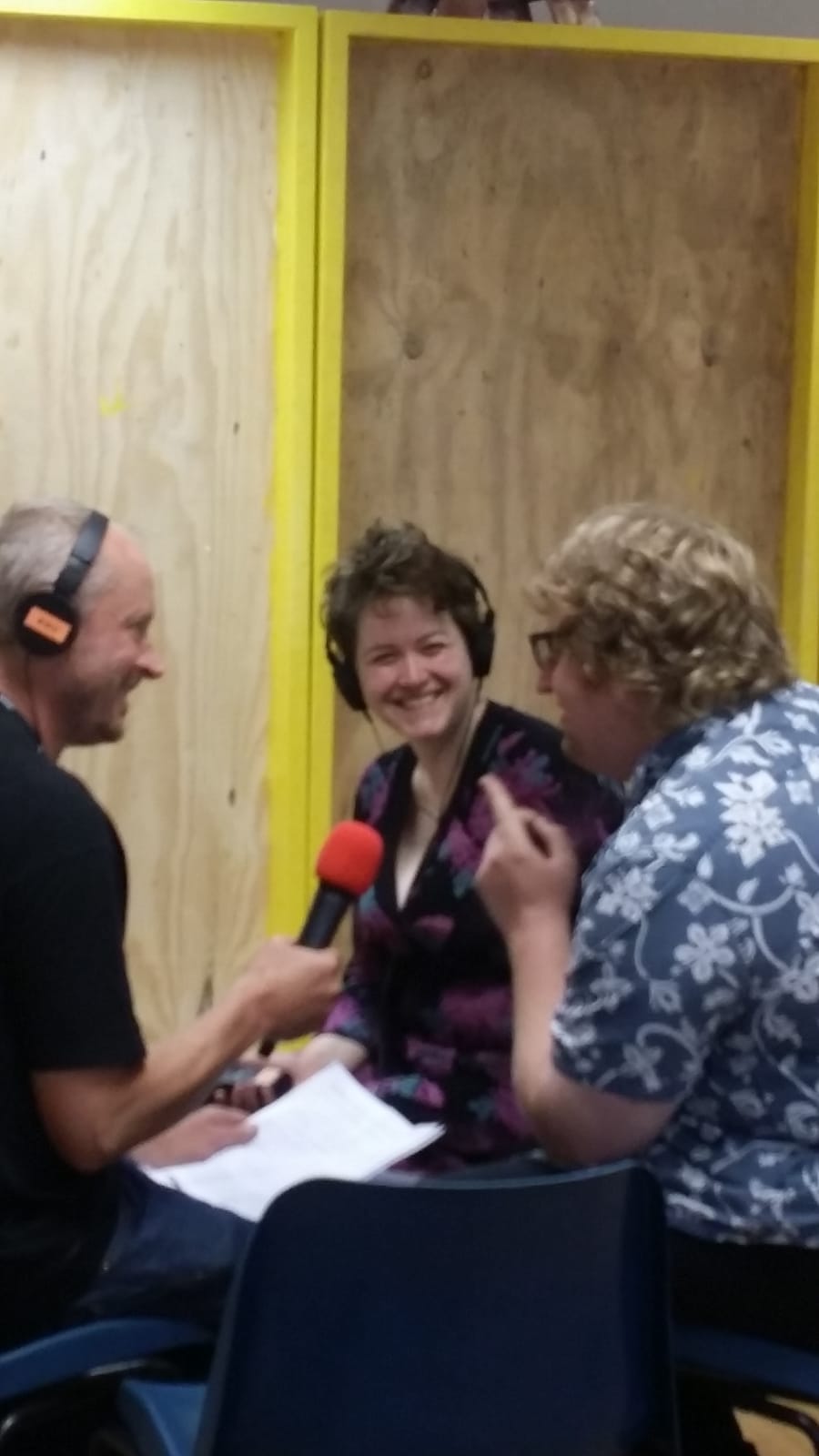 Two people being interview for the radio by a BBC presenter